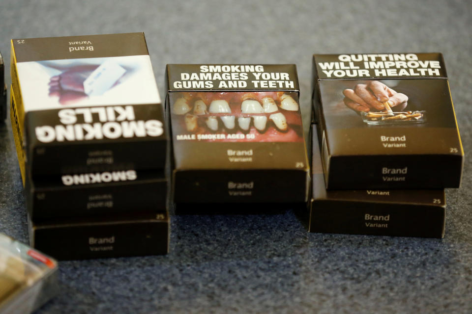 Examples of plain cigarette packaging in Canada. (FILE PHOTO: Reuters/Chris Wattie)