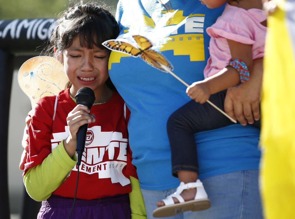 <p>Akemi Vargas, 8, cries as she talks about being separated from her father during an immigration family separation protest in front of the Sandra Day O’Connor U.S. District Court building, Monday, June 18, 2018, in Phoenix, Ariz. (Photo: Ross D. Franklin/AP) </p>