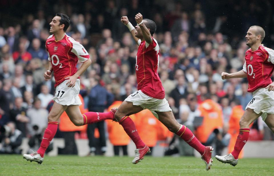 Cole celebrates winning the FA Cup in 2005 with Edu and Freddie Ljungberg Photo: Getty Images