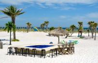 <p>How can a ranking of the best beach bars not include something named Margaritaville? This <a href="https://www.thedailymeal.com/bars/landshark-landing?venue_update=1&referrer=yahoo&category=beauty_food&include_utm=1&utm_medium=referral&utm_source=yahoo&utm_campaign=feed" rel="nofollow noopener" target="_blank" data-ylk="slk:seasonal beachside bar;elm:context_link;itc:0;sec:content-canvas" class="link ">seasonal beachside bar</a> has a fin-shaped fire pit, hammocks, and live music most weekends, not to mention a cocktail list as long as your sunburned arm, full of classics like the <a href="https://www.thedailymeal.com/drink/6-cocktails-ease-pain-or-praise-gain-tax-time-slideshow/slide-6?referrer=yahoo&category=beauty_food&include_utm=1&utm_medium=referral&utm_source=yahoo&utm_campaign=feed" rel="nofollow noopener" target="_blank" data-ylk="slk:Painkiller;elm:context_link;itc:0;sec:content-canvas" class="link ">Painkiller</a>, Bahama Mama, and Rum Runner.</p>