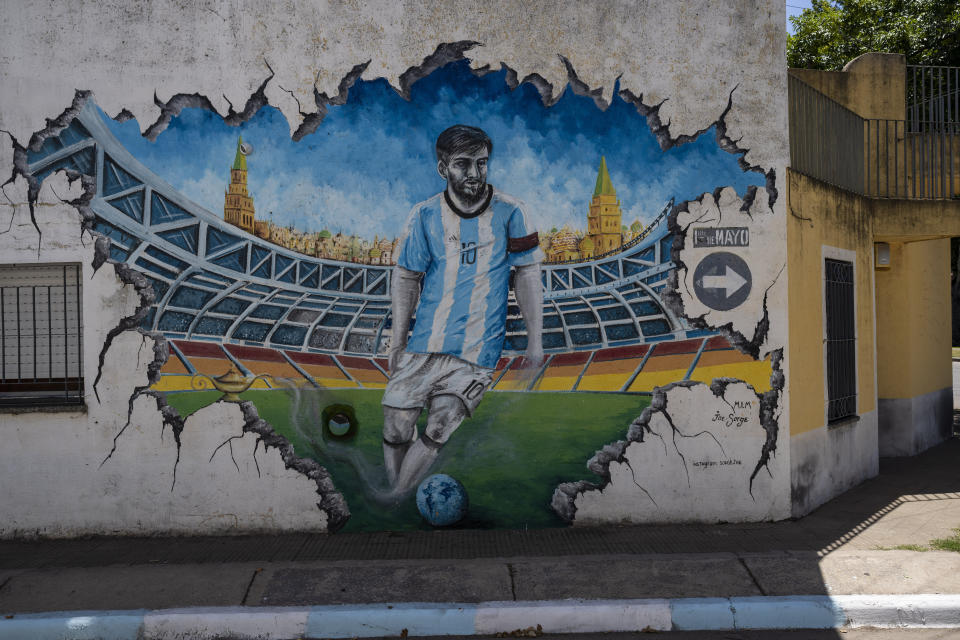A mural of soccer player Lionel Messi decorates the Las Heras neighborhood where he lived in Rosario, Argentina, Wednesday, Dec. 14, 2022. (AP Photo/Rodrigo Abd)