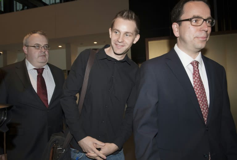 Austrian Max Schrems (C) arrives with his lawyer Herwig Hofmann (R) before a verdict at the European Court of Justice (SCJ) in Luxembourg on October 6, 2015