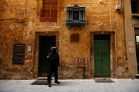 Armed police officers of the Malta Police Special Intervention Unit provide security as three men, accused of the assassination of anti-corruption journalist Daphne Caruana Galizia, leave after their lawyers’ submissions for bail at the Courts of Justice in Valletta, Malta April 17, 2018. REUTERS/Darrin Zammit Lupi