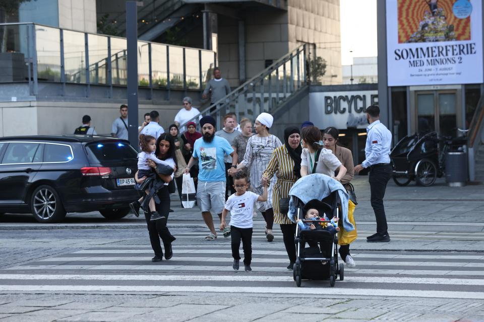 TOPSHOT - People are seen running during the evacuation of the Fields shopping center in Copenhagen, Denmark, on July 3, 2022 after Danish media reported a shooting. - Gunfire in a Copenhagen mall left 