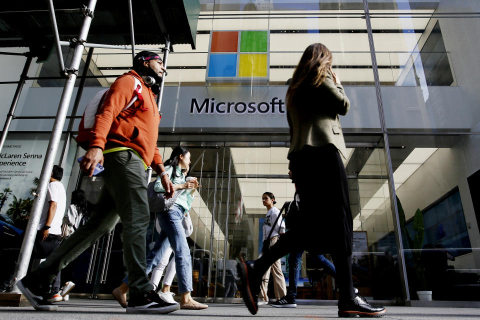 People make their way past a Microsoft on October 26, 2022 in New York City. (Photo by Leonardo Munoz/VIEWpress)