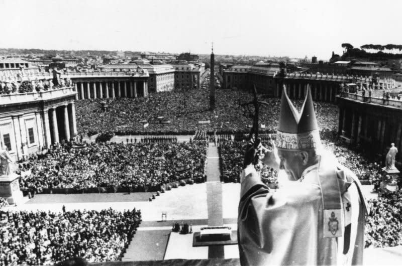 Pope John Paul II waves to more than 300,000 people from the central Loggia of St. Peter's Basilica following Easter services on April 19, 1981. Less than a month later, Turkish gunman Mehmet Ali Agca shot and injured the pope in St. Peter's Square. UPI File Photo