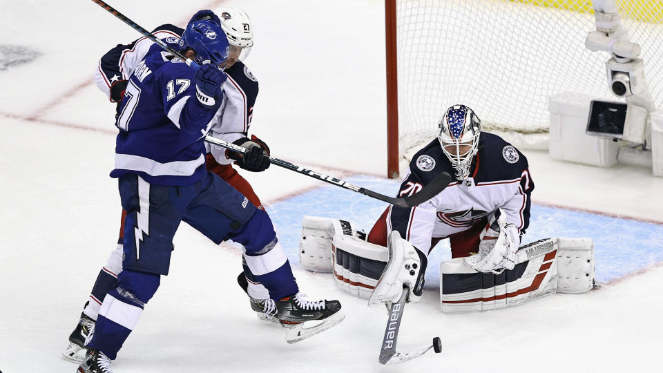 TORONTO, ONTARIO - AUGUST 11: Joonas Korpisalo #70 of the Columbus Blue Jackets makes the save against the Tampa Bay Lightning in the third overtime period in Game One of the Eastern Conference First Round during the 2020 NHL Stanley Cup Playoffs at Scotiabank Arena on August 11, 2020 in Toronto, Ontario, Canada. (Photo by Elsa/Getty Images)