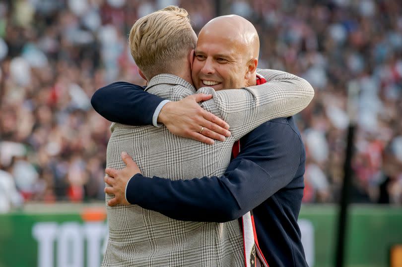 Dirk Kuyt and Arne Slot celebrate Feyenoord winning the 2022/23 Eredivisie title