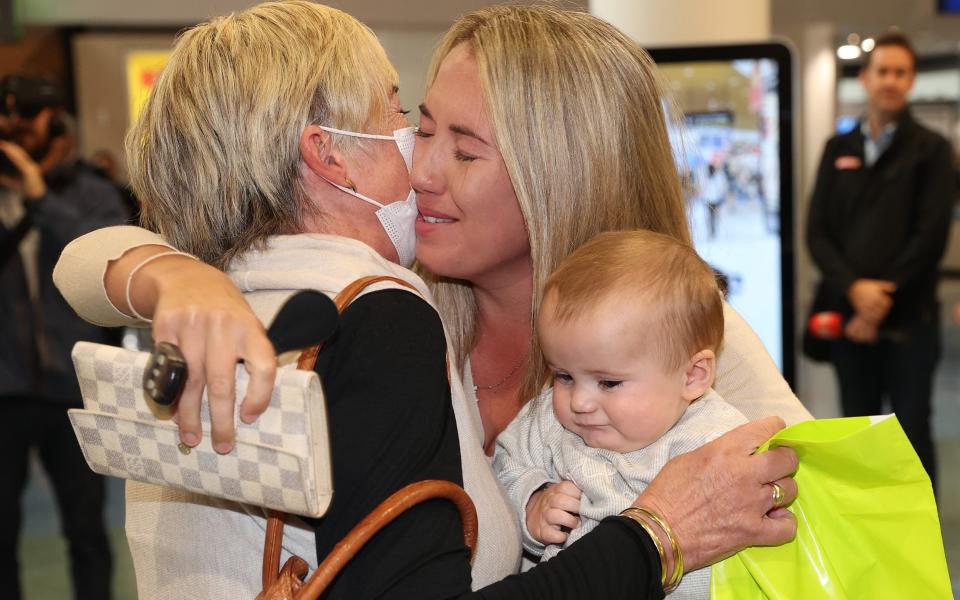 Travellers greet loved ones after arriving on the first trans-Tasman flight from Sydney to Auckland - Fiona Goodall/Getty Images