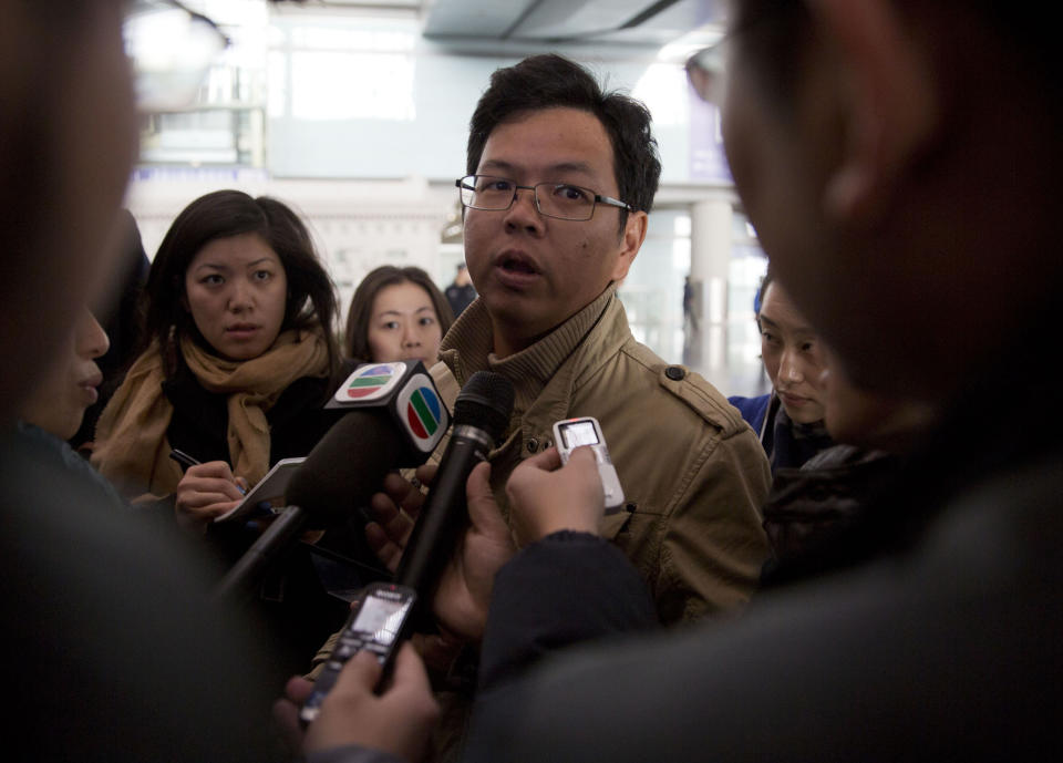 A Malaysian man who says he has relatives on board the missing Malaysian Airlines plane, talks to journalists at Beijing's International Airport Beijing, China, Saturday, March 8, 2014. A Malaysia Airlines Boeing 777-200 carrying 239 people lost contact with air traffic control early Saturday morning on a flight from Kuala Lumpur to Beijing, and international aviation authorities still hadn't located the jetliner several hours later. (AP Photo/Ng Han Guan)