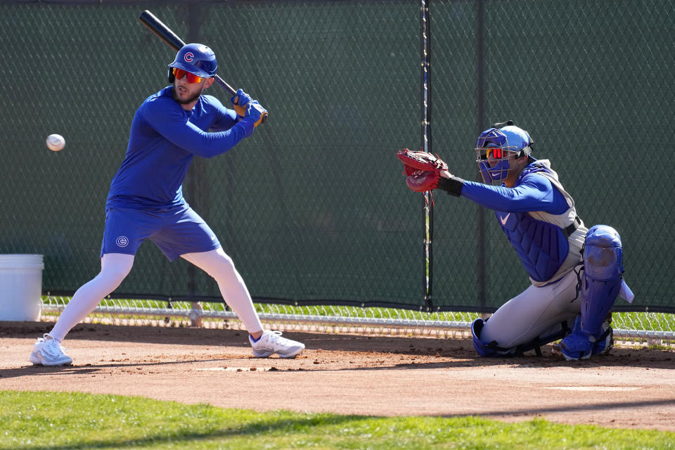 Chicago Cubs catcher Miguel Amay, right, and Miles Mastrobuoni workout during a MLB baseball spring training practice, Wednesday, Feb. 14, 2024, in Mesa, Ariz. (AP Photo/Matt York)