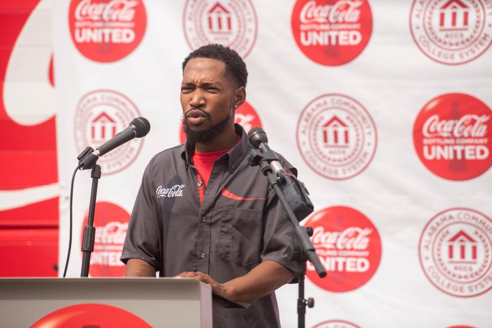 Truck driver Walter Moses speaks as Coca-Cola United donates trucks to Trenholm State Community College for driving classes in Montgomery, Ala., on Tuesday, May 9, 2023.