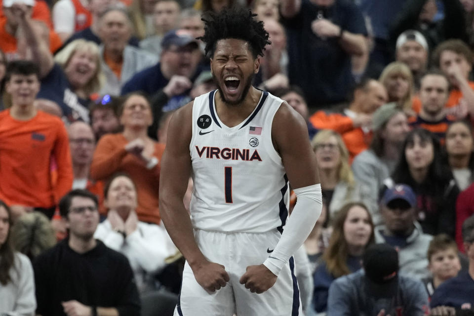 Virginia's Jayden Gardner (1) celebrates after a play against Illinois during the first half of an NCAA college basketball game Sunday, Nov. 20, 2022, in Las Vegas. (AP Photo/John Locher)