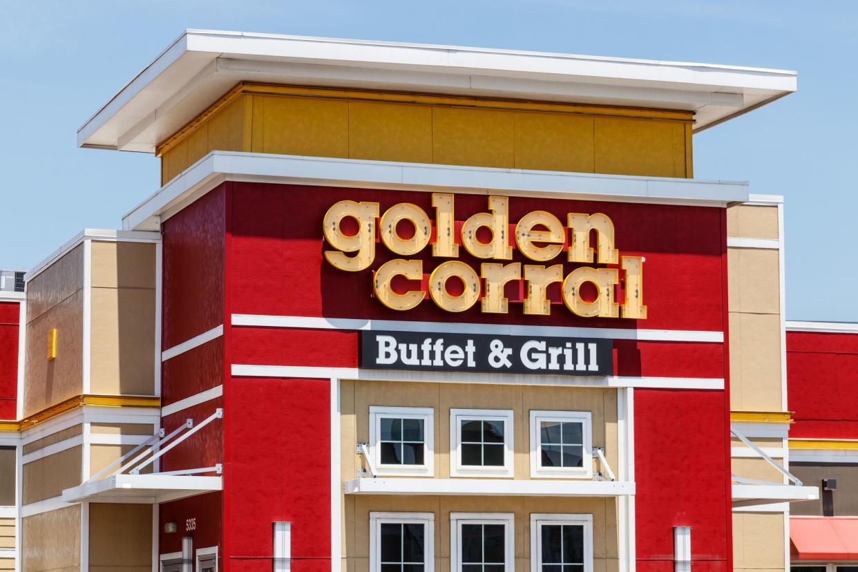 Top front exterior of Golden Corral Buffet & Grill, Fort Wayne, Indiana, on a sunny day, a light blue sky the background