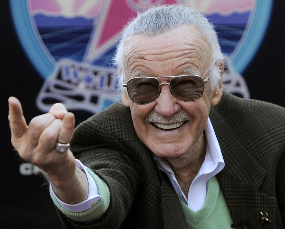 FILE - In this Jan. 4, 2011 file photo, Comic book creator Stan Lee strikes the Spiderman pose as he poses after receiving a star on the Hollywood Walk of Fame in Los Angeles. A former business manager of Stan Lee has been arrested on elder abuse charges involving the late comic book icon. Los Angeles police say Keya Morgan was taken into custody in Arizona early Saturday, May 25, 2019, on an outstanding arrest warrant. Morgan was charged earlier this month with felony allegations of theft, embezzlement, forgery or fraud against an elder adult, and false imprisonment of an elder adult. (AP Photo/Chris Pizzello, File)