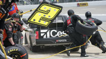 Kyle Busch (51) gets service in the pits during the NASCAR Truck Series auto race at Richmond International Raceway in Richmond, Va., Saturday, April 17, 2021. (AP Photo/Steve Helber)