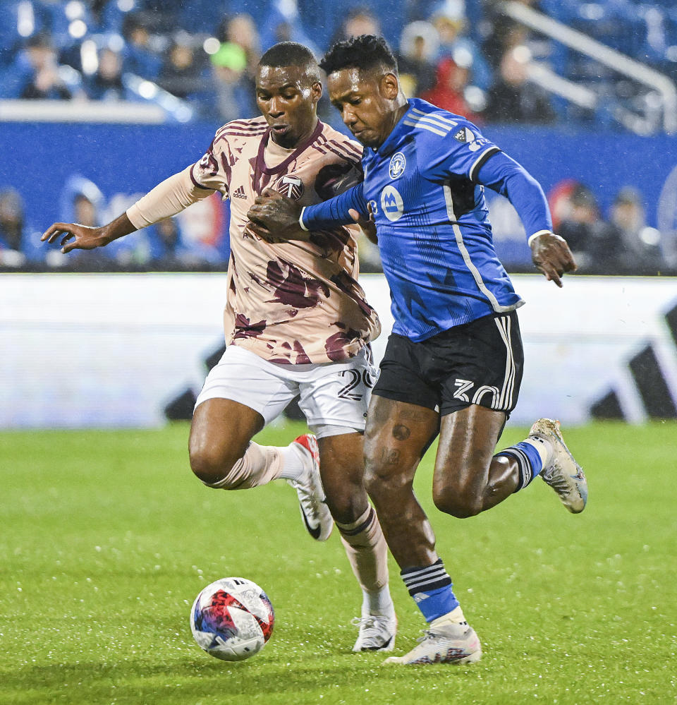 CF Montreal's Romell Quioto, right, holds off a challenge from Portland Timbers' Juan Mosquera during first-half MLS soccer match action in Montreal, Saturday, Oct. 7, 2023. (Graham Hughes/The Canadian Press via AP)