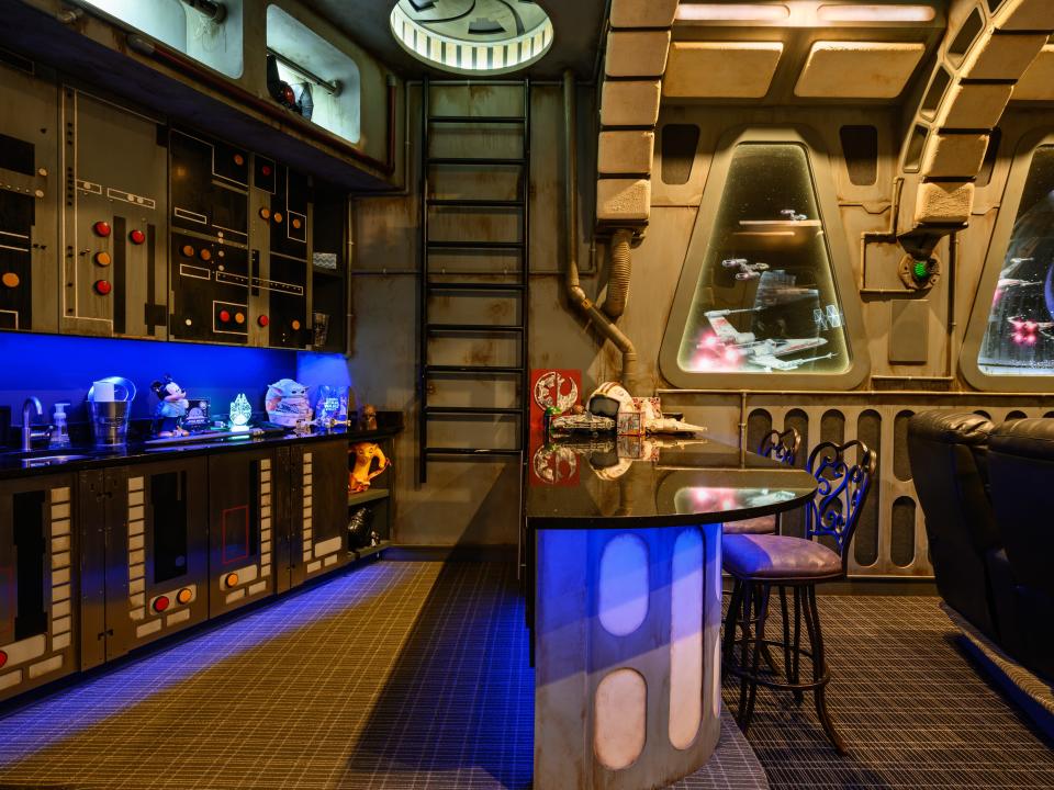 The theater comes with a space-themed bar