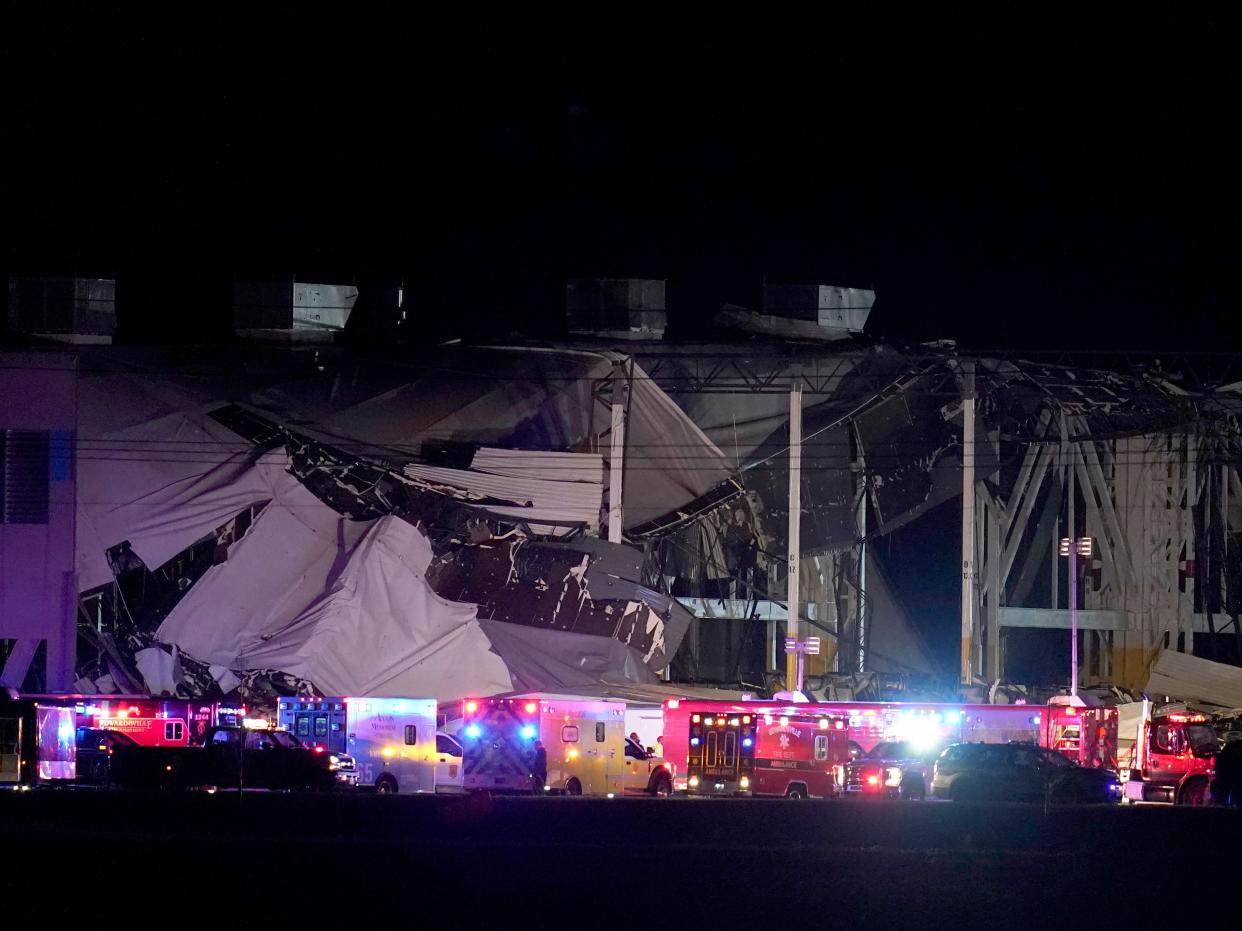 An Amazon distribution center is heavily damaged after a strong thunderstorm moved through the area Friday, Dec. 10, 2021, in Edwardsville, Ill.