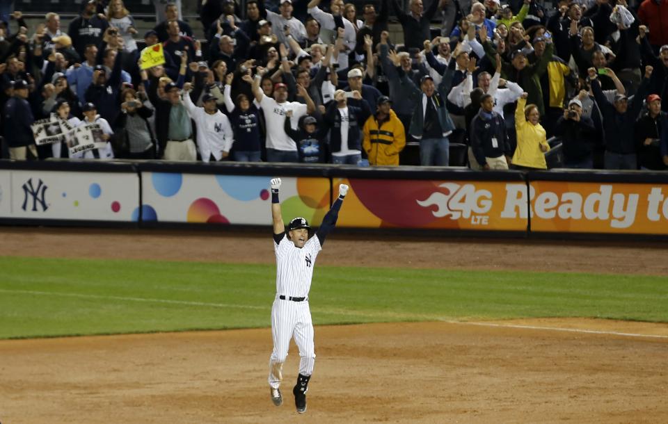 New York Yankees' shortstop Derek Jeter celebrates his game-winning single in the bottom of the ninth inning in his final at bat at Yankee Stadium in New York to defeat the Baltimore Orioles 6-5 in their MLB American League Baseball Game, in this September 25, 2014 file photo. REUTERS/Mike Segar/Files (UNITED STATES - Tags: SPORT BASEBALL TPX IMAGES OF THE DAY)