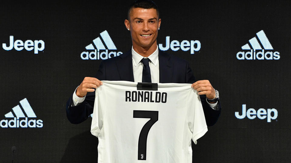 TURIN, ITALY – JULY 16: Juventus new signing Cristiano Ronaldo poses for the media during the press conference on July 16, 2018 in Turin, Italy. (Photo by Valerio Pennicino – Juventus FC/Juventus FC via Getty Images)