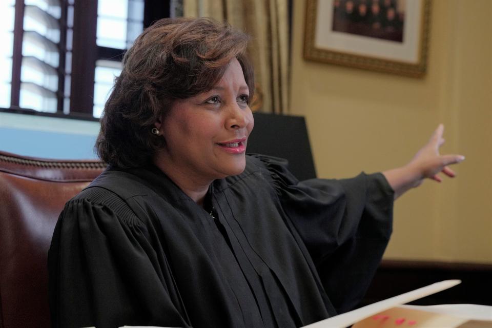 U.S. District Judge J. Michelle Childs gestures as she works in her chambers on Friday, Feb. 18, 2022, in Columbia, S.C.