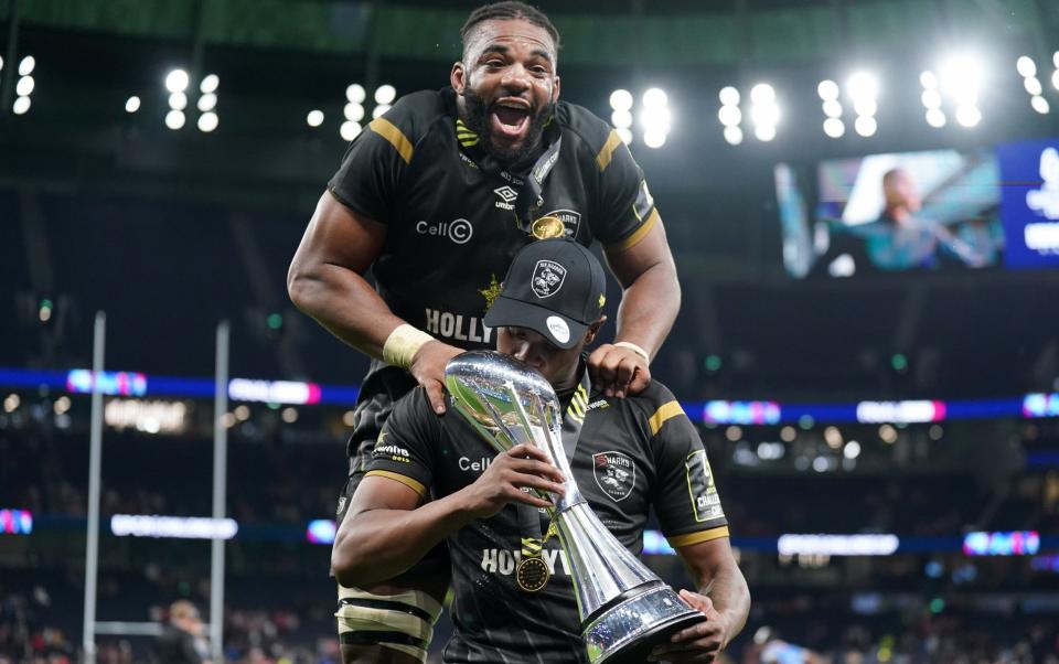 Sharks players celebrate with the trophy