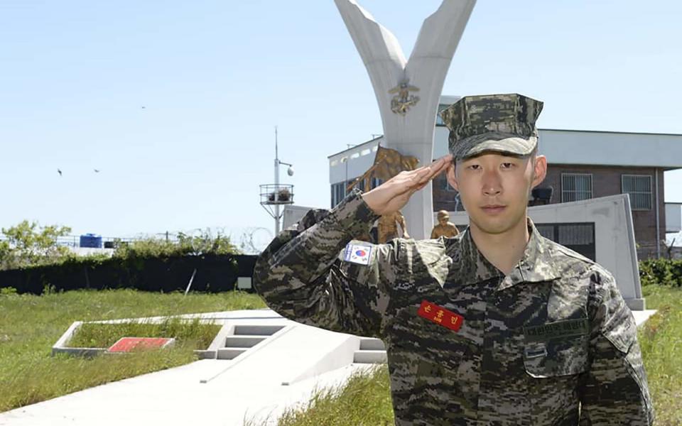 Tottenham Hotspur's South Korean striker Son Heung-min in military uniform posing during his basic military training in Jeju island - Handout/AFP