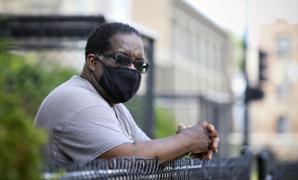 The Rev. Marshall Hatch, of New Mount Pilgrim Missionary Baptist Church, poses for a photograph in Chicago, Wednesday, July 22, 2020. The nation's third-largest city is on edge amid a surge in gun violence and protests sparked by the death of George Floyd. Now Chicago is also awaiting possible greater tension in the form of a plan by President Donald Trump to dispatch dozens of federal agents to the city. Activists say if the agents act as they did recently in Portland, Oregon, it could spark even more violence and attract the kind of agitators who attacked police during a recent downtown protest. (AP Photo/Teresa Crawford)