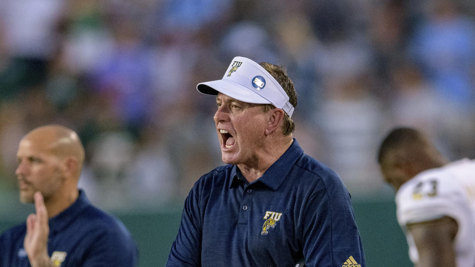 FILE - In this Aug. 29, 2019, file photo, Florida International head coach Butch Davis yells at his players during an NCAA football game against Tulane in New Orleans. Florida International (1-1) faces Texas Tech on Saturday night in the final non-conference game for the Red Raiders. (AP Photo/Matthew Hinton, File)