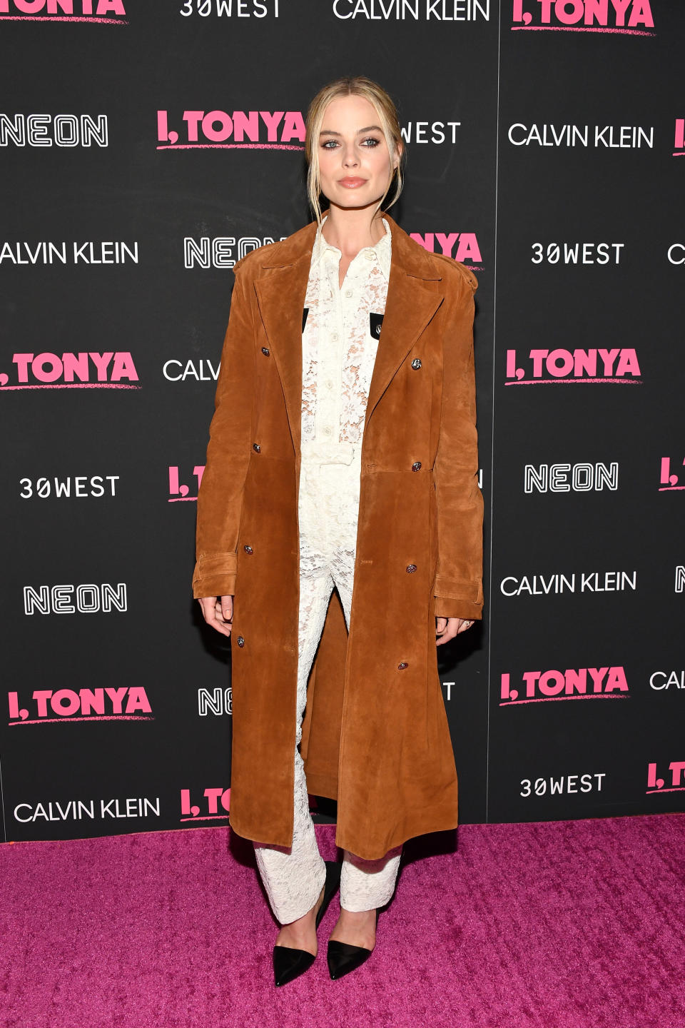 <p>The actress wore a white lace jumpsuit with a cognac suede coat for the premiere of her new movie. (Photo: Getty Images) </p>