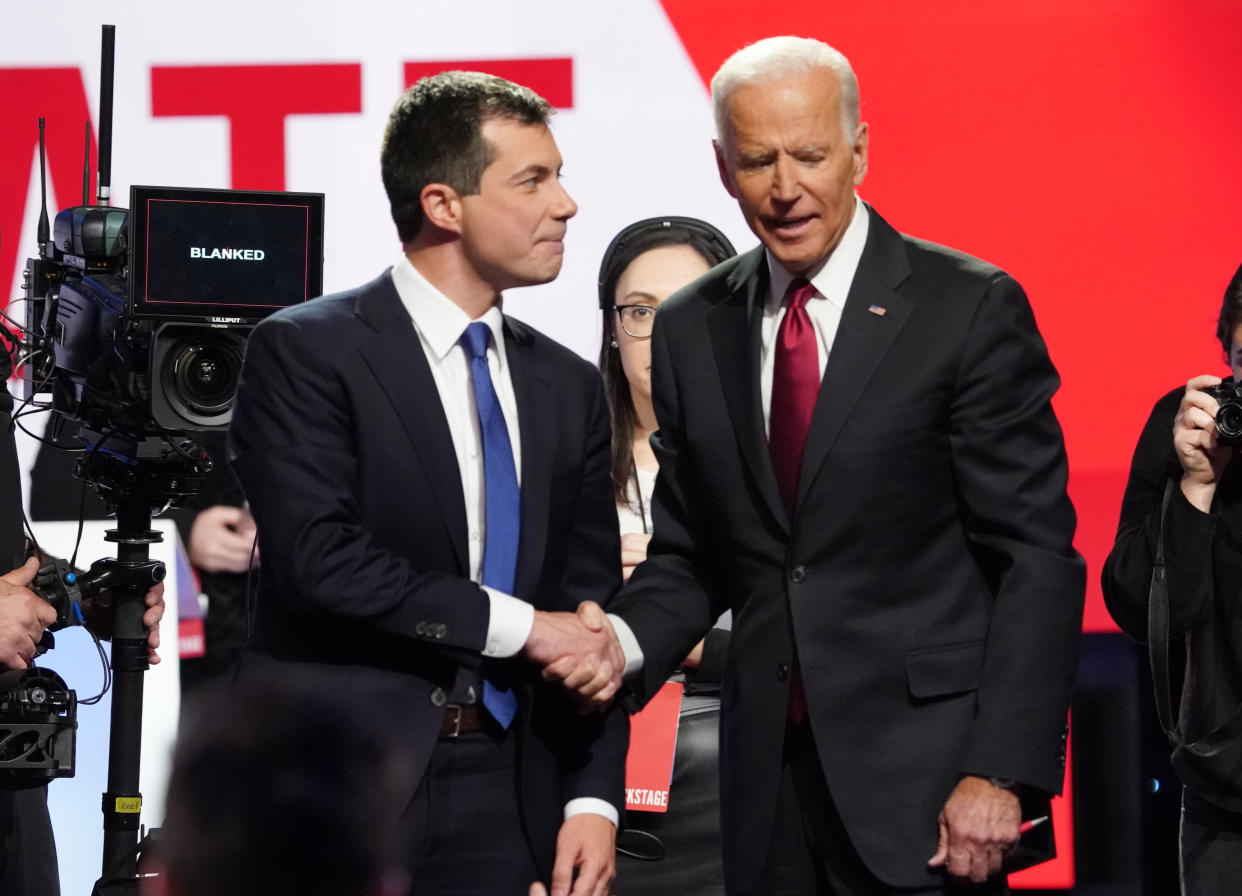 Former South Bend, Indiana, Mayor Pete Buttigieg, left, shakes hands with former Vice President Joe Biden after the Democratic presidential debate in October. Left-wing activists see both men as an obstacle to electing a progressive president. (Photo: Shannon Stapleton / Reuters)