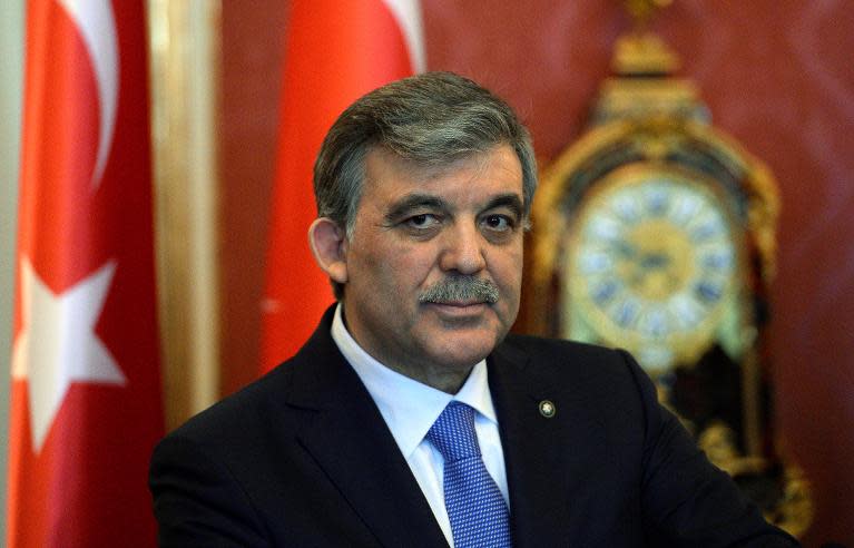 Turkey's President Abdullah Gul (C) gives a statement with his Hungarian counterpart in the presidental palace in Budapest on February 17, 2014 during their joint press conference