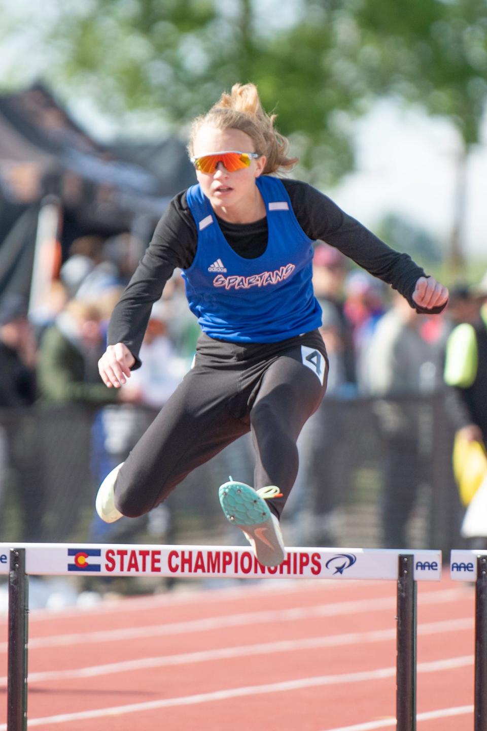 Swallows Charter Academy's Kaitlyn Pearson clears a hurdle in the Class 2A 300 meter hurdle qualifying race during the CHSSA state track and field meet on Saturday, May 21, 2022 at Jeffco Stadium.