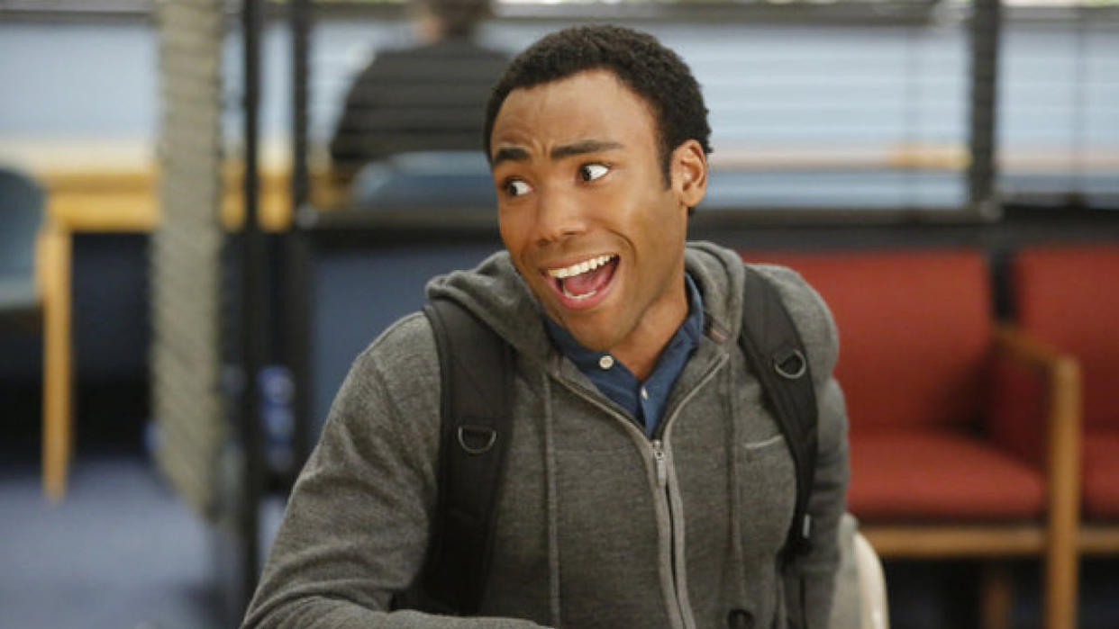  Donald Glover smiling as Troy Barnes in Community. 