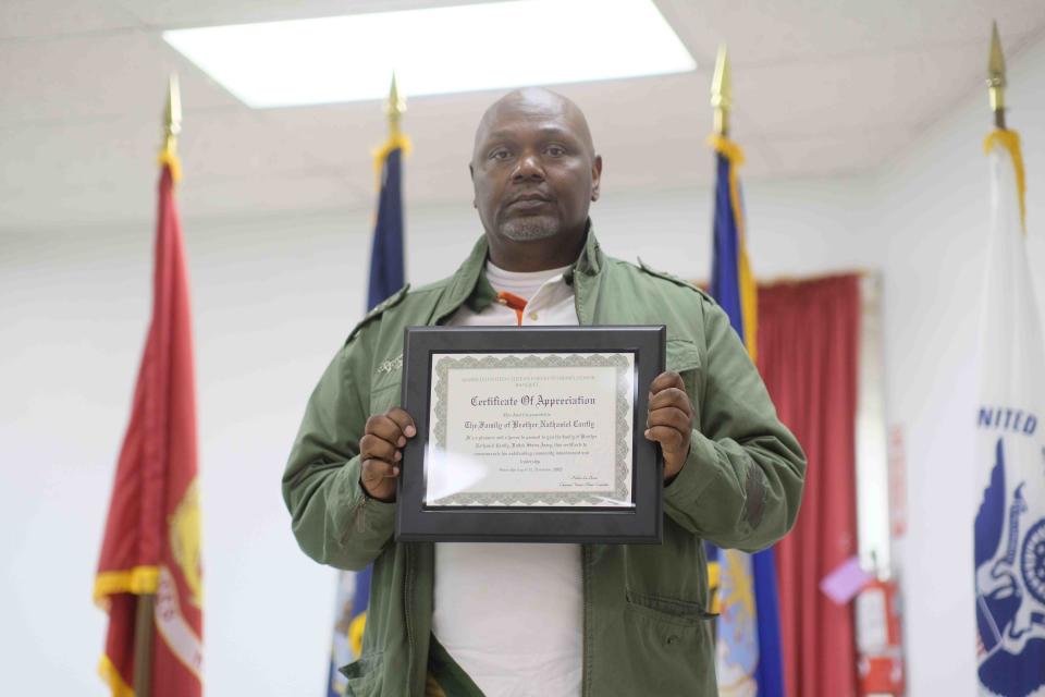 Leonard Cantly accepts an award for his father the late U.S. military veteran Nathaniel Cantly, Saturday at the Veteran's Honor Banquet at the Amarillo United Citizen's Forum.