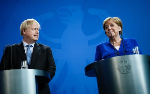 Boris Johnson and Angela Merkel - Credit: CLEMENS BILAN/EPA-EFE/REX