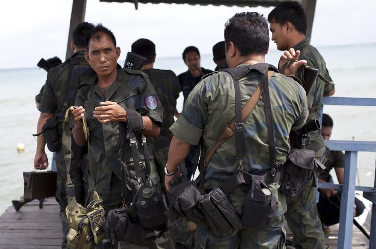 Malaysian policemen return from a sea patrol in Tanjung Labian near Lahad Datu, on the Malaysian island of Borneo, on February 16, 2013. The Philippines called for a peaceful resolution to a tense stand-off in a remote area on Borneo island in Malaysia, where hundreds of armed Filipinos landed on Tuesday