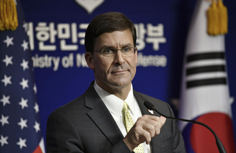 U.S. Defense Secretary Mark Esper attends a joint press conference with South Korean Defense Minister Jeong Kyeong-doo, after the 51st Security Consultative Meeting (SCM) at the Defense Ministry in Seoul Friday, Nov. 15, 2019. U.S. Defense Secretary Esper says South Korea is wealthy enough to pay a bigger share of the cost of having U.S. troops on its soil. (Jung Yeon-je/Pool Photo via AP)