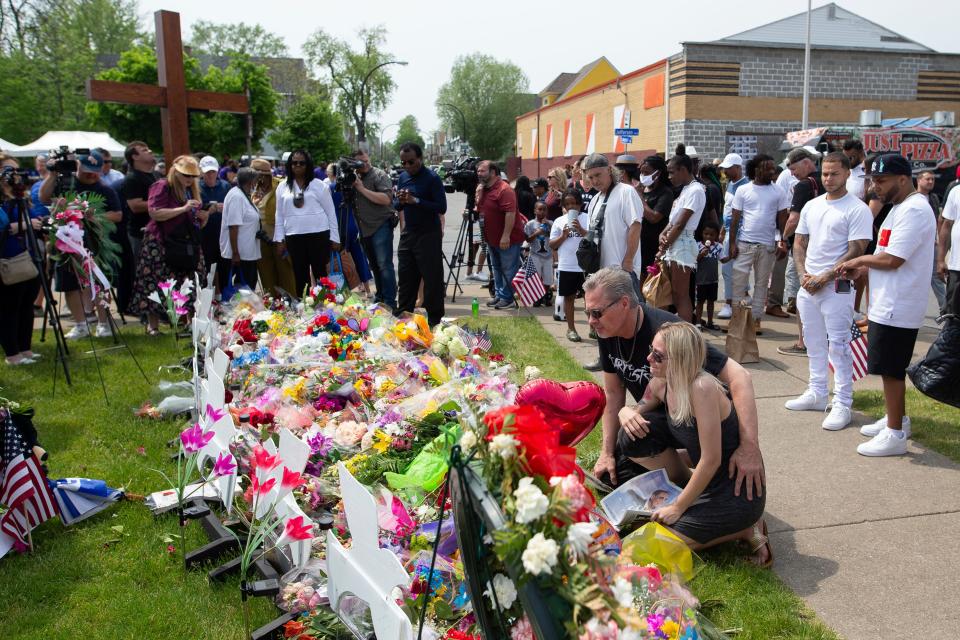 Michael Jordan and Heather Delorm, friends of Buffalo shooting victim Roberta Drury, visit a memorial for the victims of the Buffalo supermarket shooting outside the Tops Friendly Market on May 21 in Buffalo, N.Y.