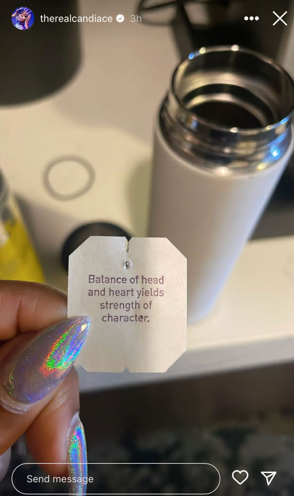 An image of Candiace Dillard Bassett showing her manicure and a tea bag tag.