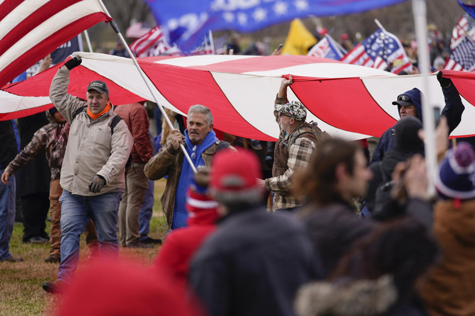 FILE - Supporters loyal to President Donald Trump attend a rally on the Ellipse near the White House on Jan. 6, 2021, in Washington. Trump's lawyers have suggested their strategy in his election interference case in Washington involves distancing their client from the horde of U.S. Capitol rioters, whom the former president has embraced on the campaign trail. (AP Photo/Julio Cortez, File)