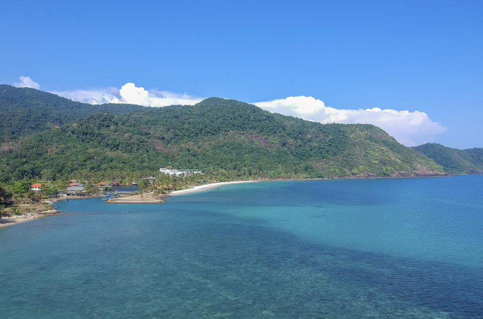 Blue water lines the coast of Koh Chang island in March 2018, Trat Province, southern Thailand. American expat Wesley Barnes, an English-language teacher in Thailand, was sued for criminal defamation by a hotel at which he stayed on the island because of derogatory reviews he posted online. He could face up to five years in prison on two charges if tried and found guilty. (AP Photo/Phusit wirutthanatporn)