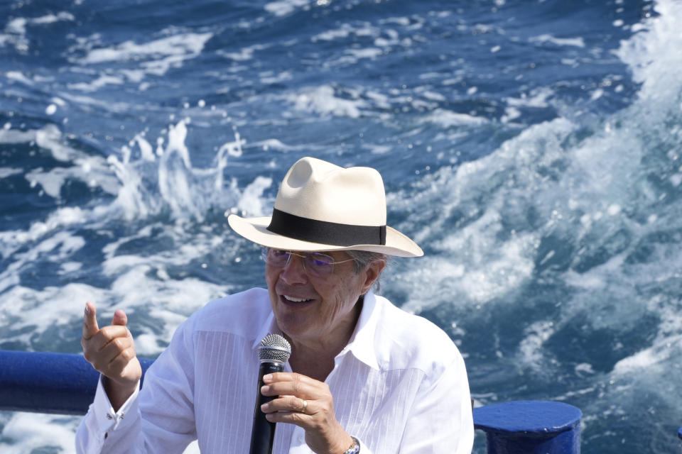 FILE- Ecuador's President Guillermo Lasso speaks at a signing ceremony that expands the Galapagos Maritime Reserve by 60,000 square kilometers, aboard the Sierra Negra research vessel in Puerto Ayora, Galapagos Islands, Ecuador, Friday, Jan. 14, 2022. The U.S., Britain and a handful of others aren’t sending dignitaries to the Beijing Games as part of a diplomatic boycott, but the Chinese capital is still attracting an array of world leaders for the opening ceremony on Friday, Feb. 4. Lasso, who is seeking to renegotiate the country's $4.6 billion debt to China, will be in Beijing for the ceremony. (AP Photo/Dolores Ochoa)