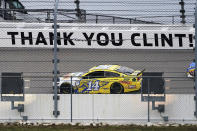 Clint Bowyer (14) drives past a message about his last season during a NASCAR Cup Series auto race at Kansas Speedway in Kansas City, Kan., Sunday, Oct. 18, 2020. (AP Photo/Orlin Wagner)