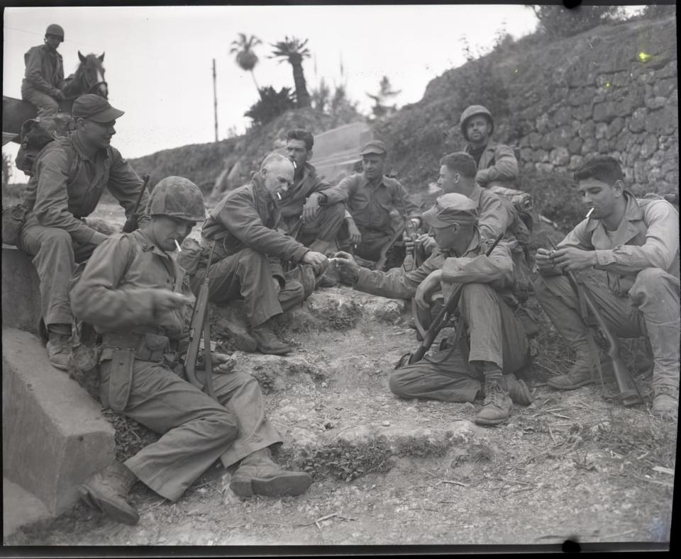 <div class="inline-image__caption"><p>Columnist Ernie Pyle rests on the roadside with a patrol from the 1st Marine Division.</p></div> <div class="inline-image__credit">Barnett/National Archives</div>