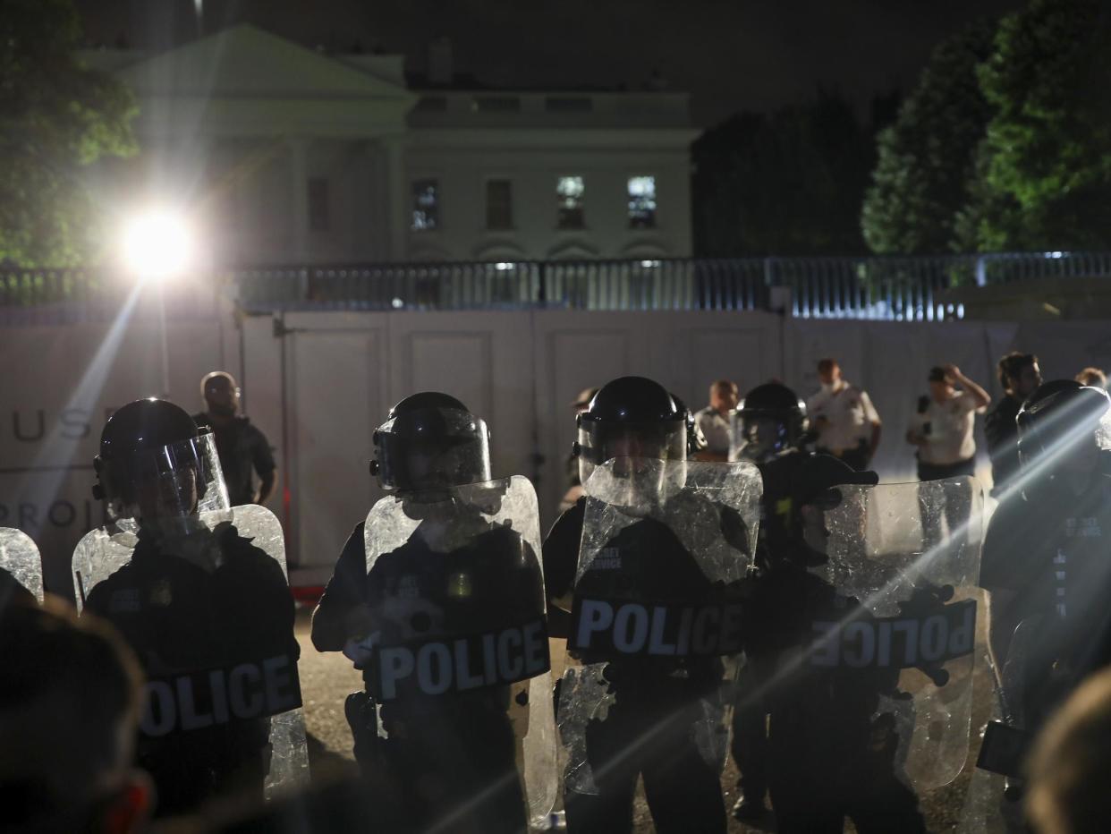 Demonstrators hold a protest in response to the police killing of George Floyd in Lafayette Square Park near the White House on 29 May 2020 in Washington, DC: (2020 Getty Images)