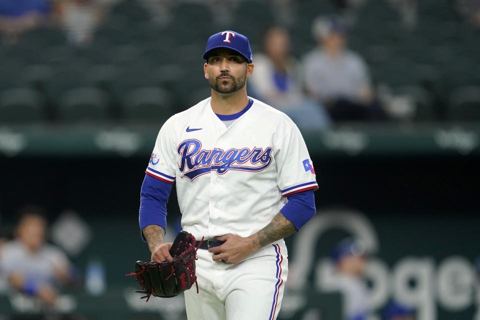 Texas Rangers starting pitcher Matt Bush walks to the dugout after working against the Kansas City Royals in the first inning of a baseball game, Wednesday, May 11, 2022, in Arlington, Texas. (AP Photo/Tony Gutierrez)