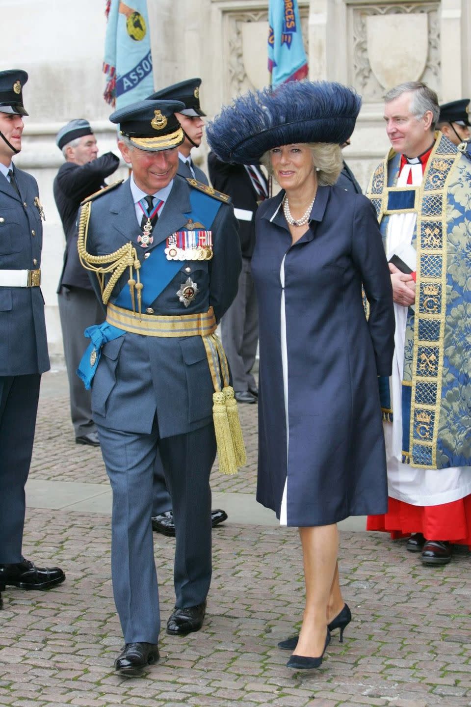 <p>For the commemoration of the 65th anniversary of the Battle of Britain, Camilla wore an elaborate feathered hat in navy with a matching coatdress. </p>