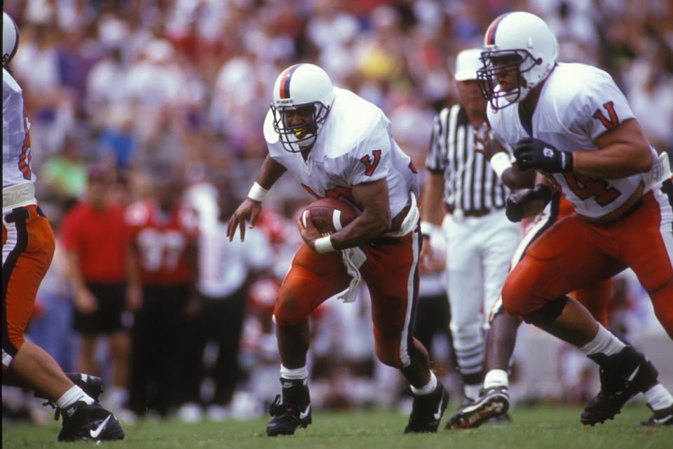 COLLEGE PARK, MD - SEPTMEBR 1:  Charles Way #30 of the Virginia Cavaliers runs with the ball during a college football game against the Maryland Terrapins on September 1, 1993 at Byrd Stadium in College Park, Maryland.  (Photo by Mitchell Layton/Getty Images)